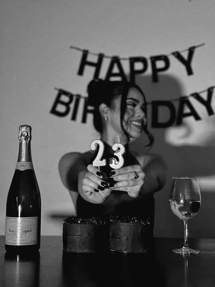 Visual Hook: A celebratory monochrome moment captured with a shallow depth of field, hi...