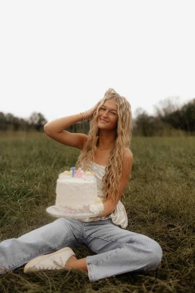 Visual Hook: A joyful, relaxed portrait of a person celebrating a birthday in a natural...